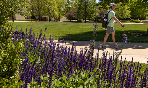 Student walking on campus.