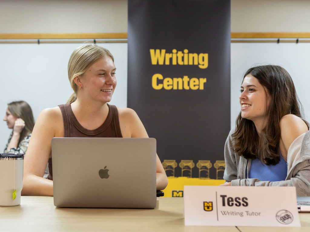 Student tutor at work in the Writing Center