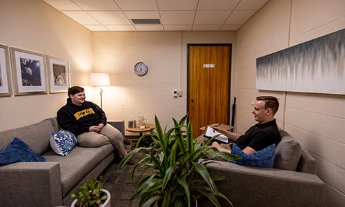 Student smiling during therapy session.