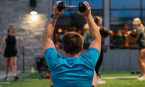 Student at group fitness class.