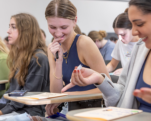 Students in class laughing.