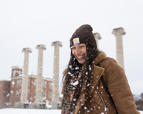 Student smiling in snow