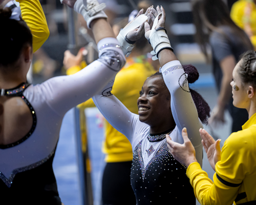 Students at gymnastics event.