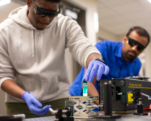 Students lab with goggles.
