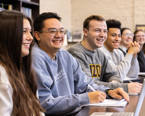 Students sitting and laughing.