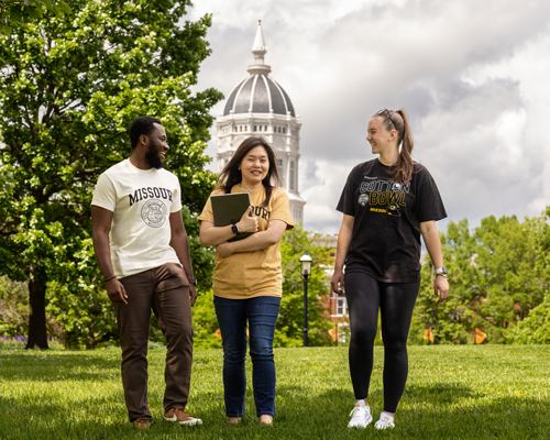 Students walking on campus in front of Jesse.