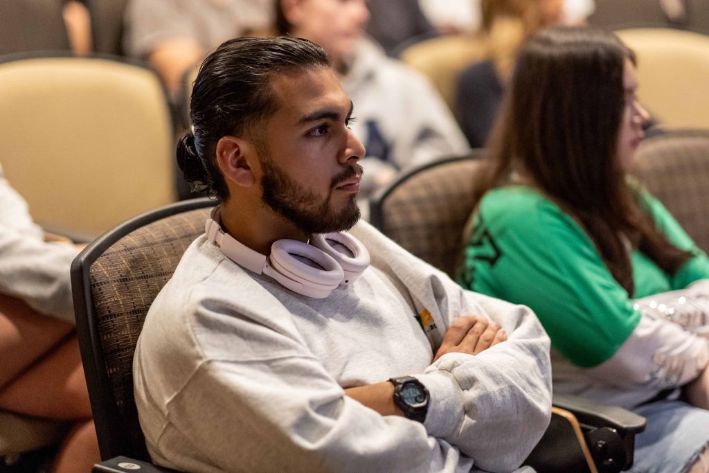 Student listening intently in a workshop
