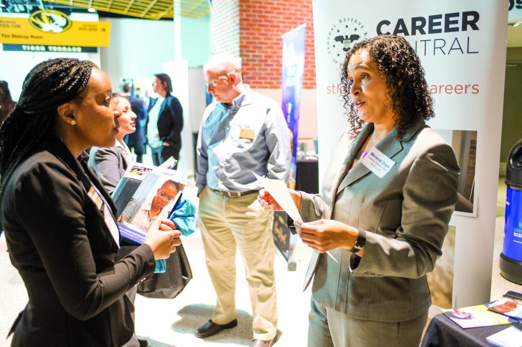 Student talking to staff at Career Fair.