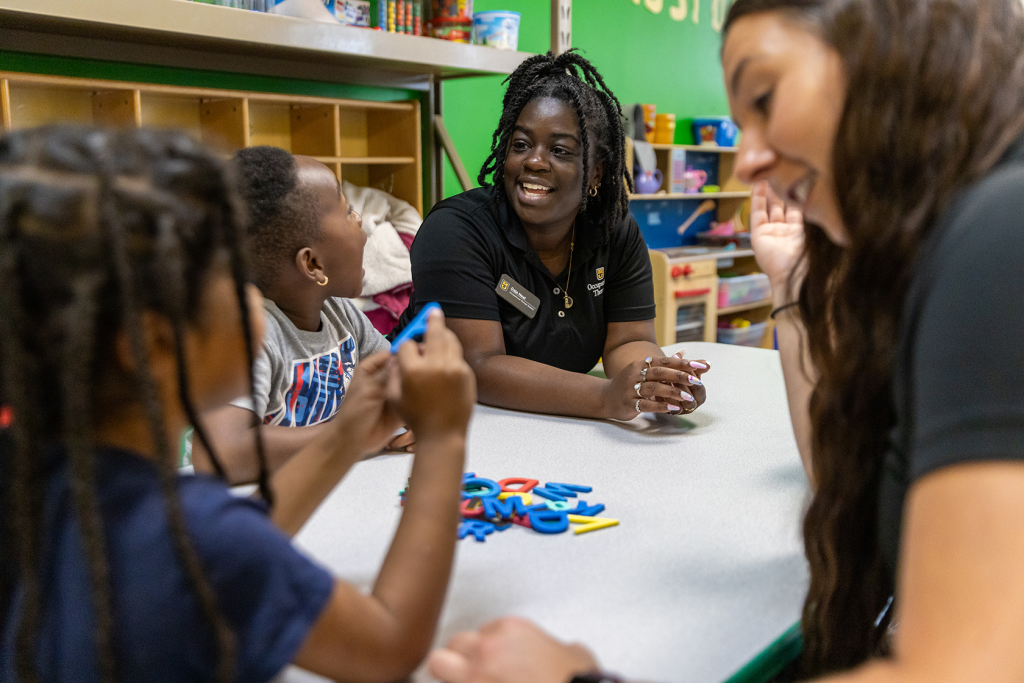 Students working with community children in an Early Learning Center