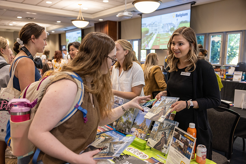 Student speaking with staff from International Programs about study abroad opportunities.