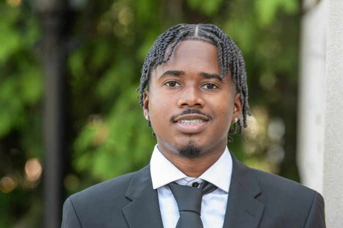 Jaylen stands smiling.