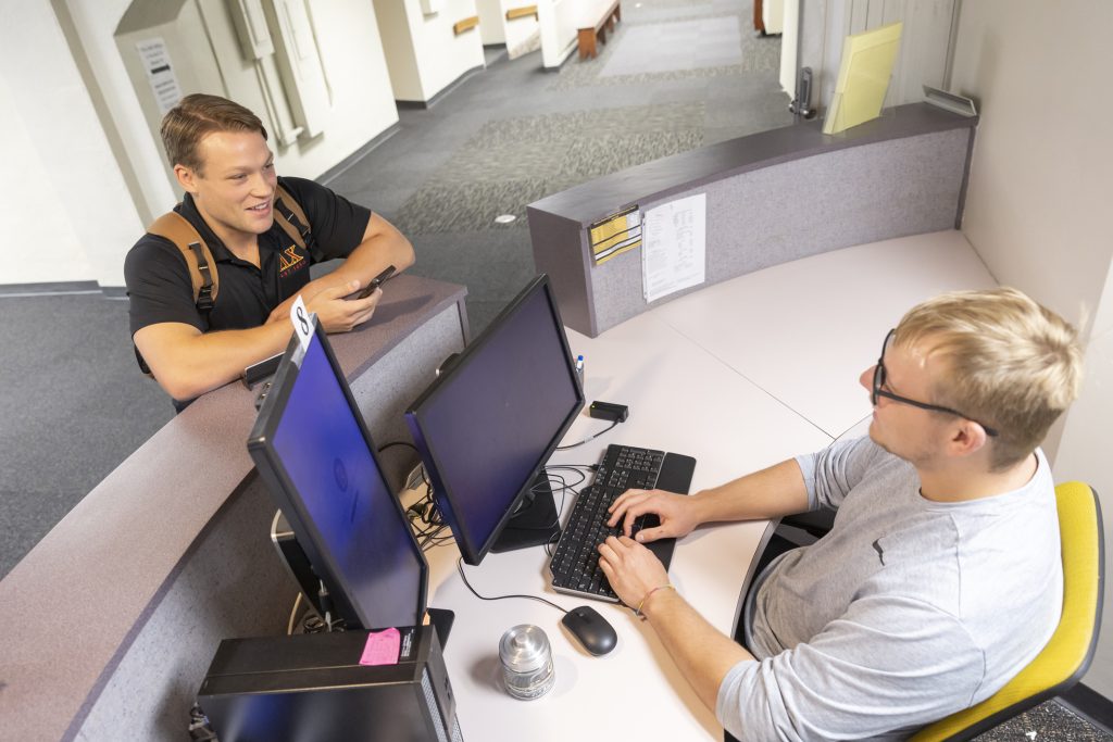 Student receiving assistance at the Financial Aid Offic