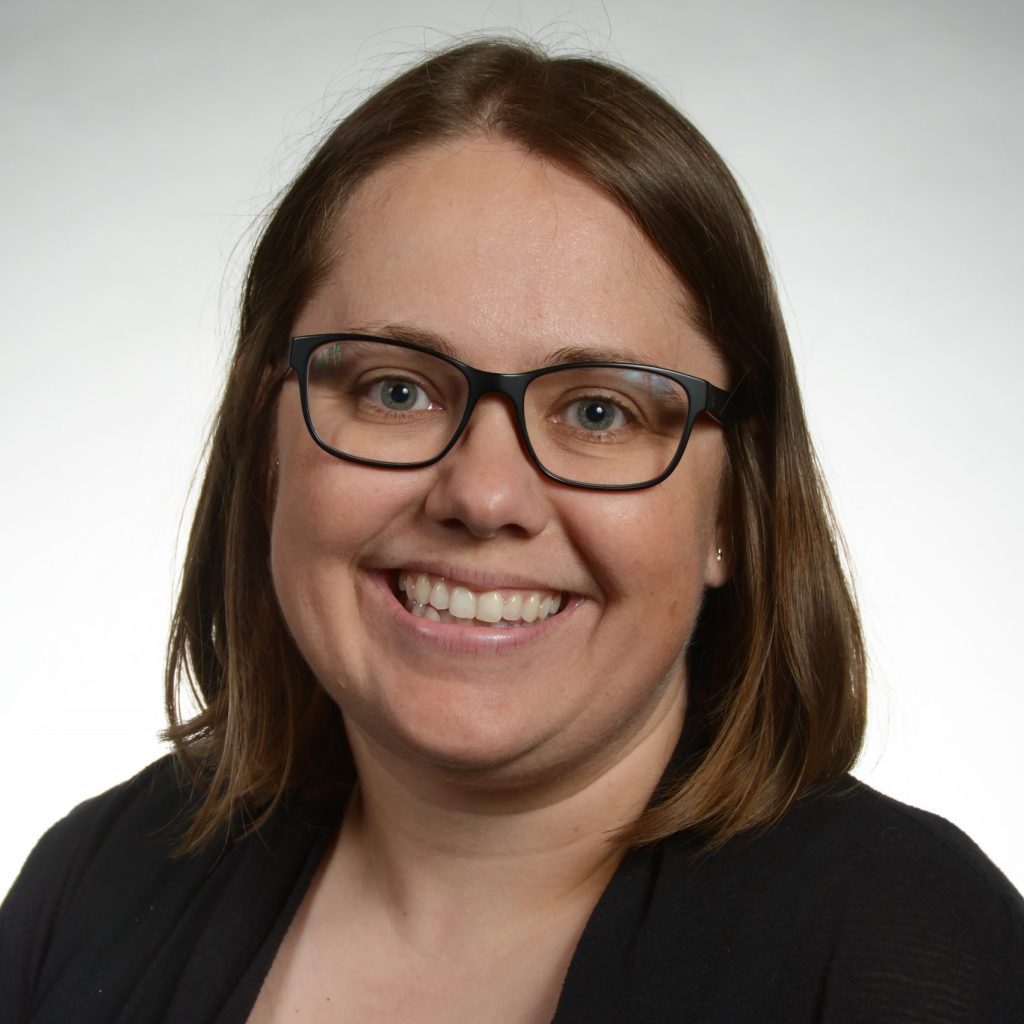 Emily Mahler smiles for headshot