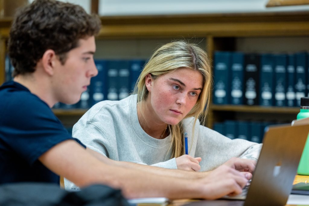 Students looking at computer.