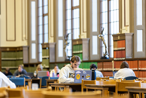 Student studying in Ellis Library.