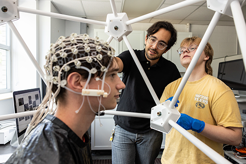 The Learning and Memory Psychophysiology Laboratory of Principal Investigator Dr. Roberto Cofresí with Research Specialist Lead Dr. Sandie Keerstock and undergraduate researchers in the Melvin H. Marx Building.