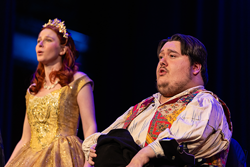 Two students performing on stage.