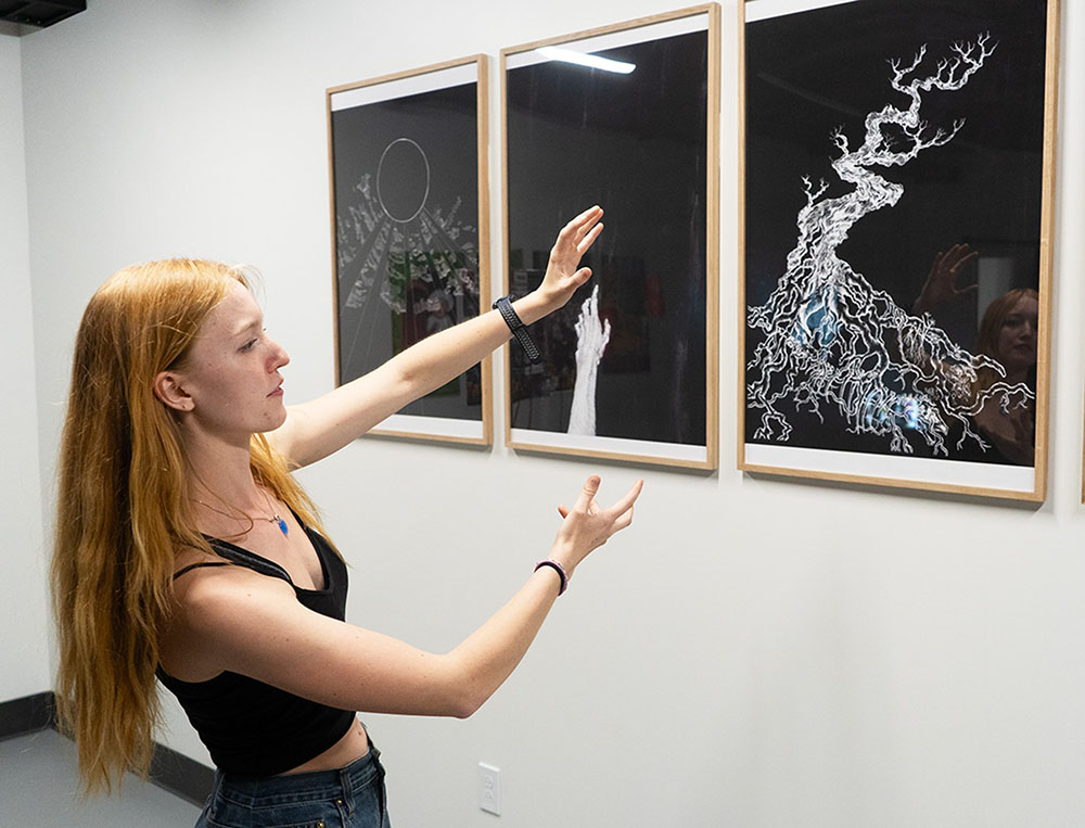 Student looking at her student work.