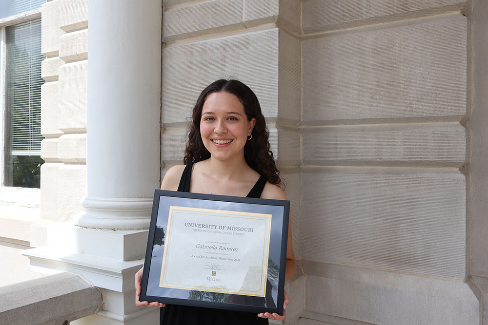 Gabriella Ramirez holding certificate.