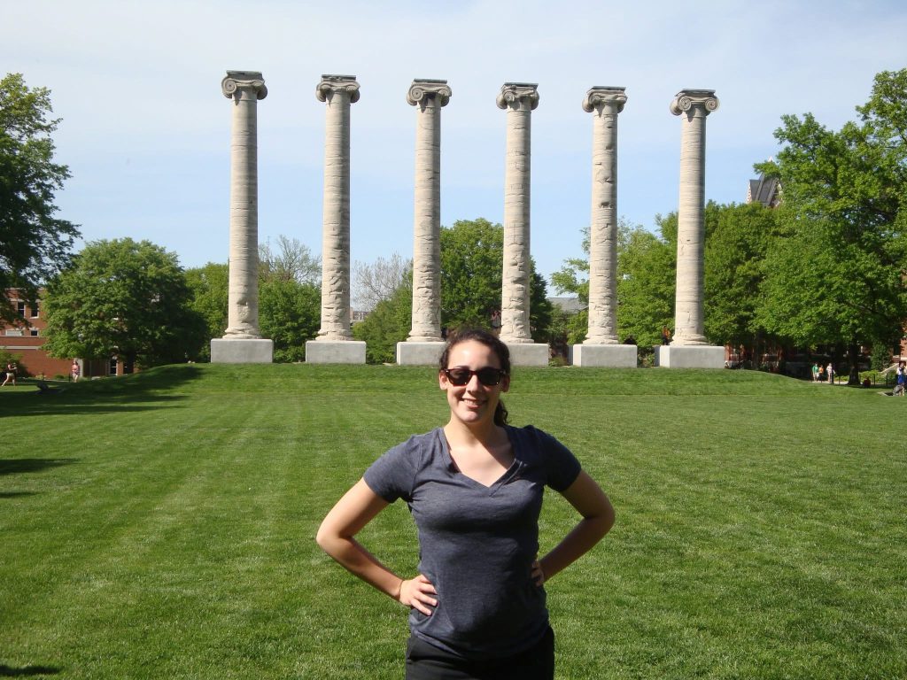 Sarah Neuroth in front of the columns at Mizzou.