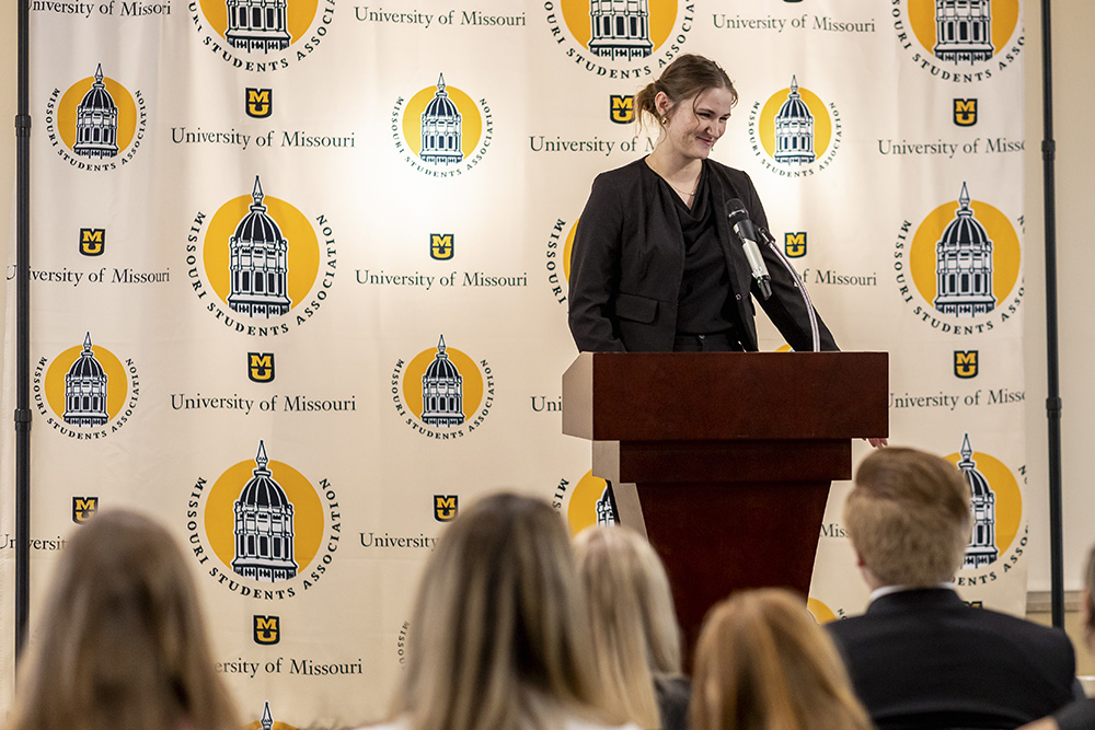 Student speaking at podium during Missouri Students Association event.