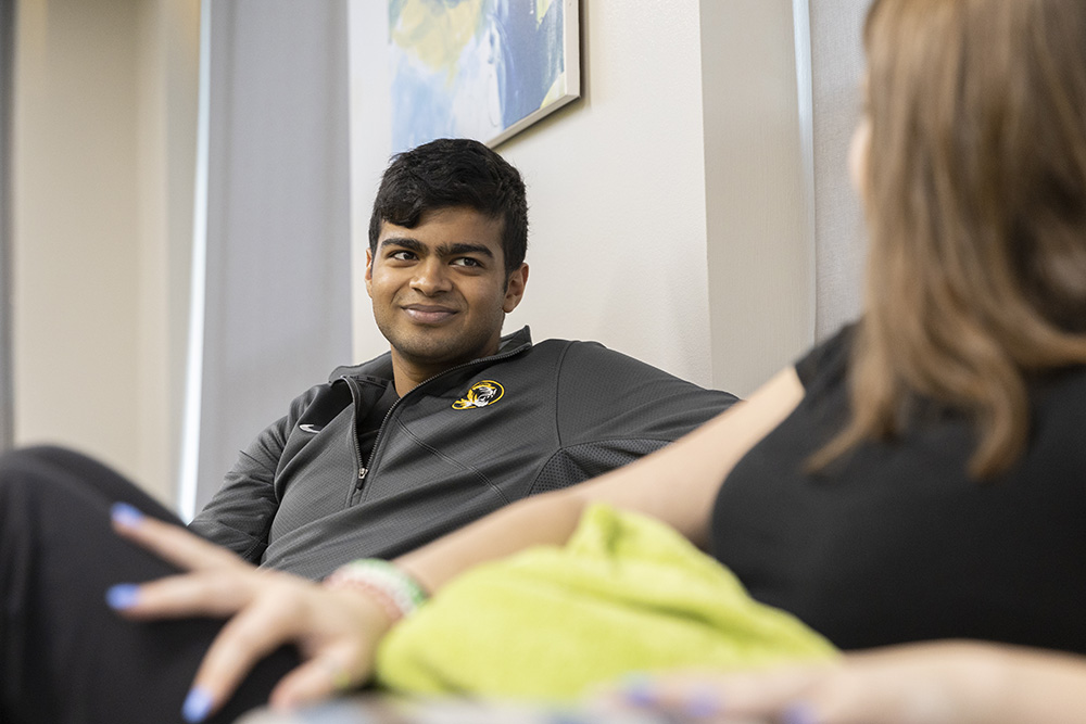 Student talking to resident advisor.