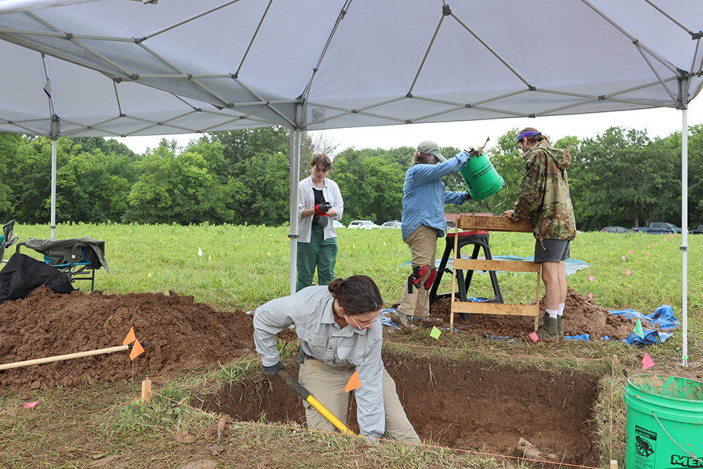 Students digging in the excavation units at the Bothwell Lodge State Historic Site.